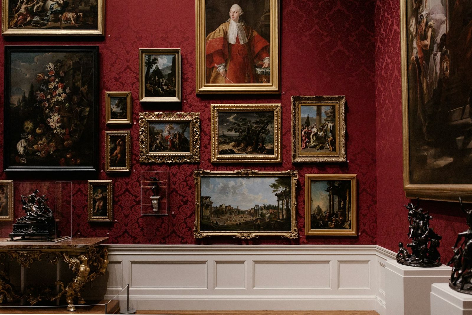 Salon-style gallery wall of framed paintings